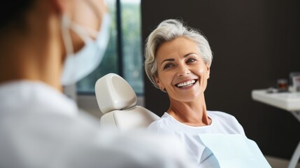 Happy mature woman during teeth checking at dental clinic. - Powered by Adobe