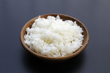 Cooked rice on dark background.