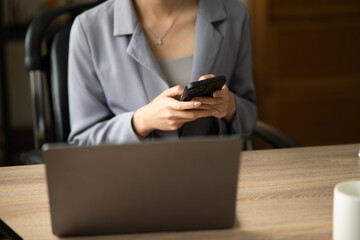 Asian businesswoman holding notebook about business, spending money