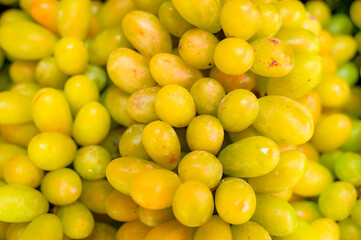 Background of ripe green grapes on a fresh market stall