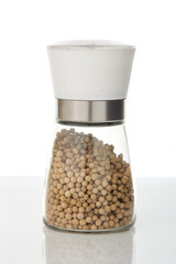 White pepper in a glass jar