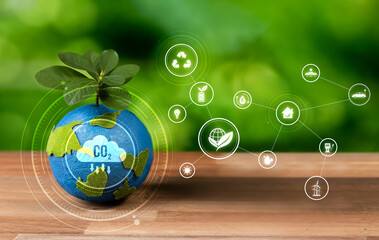 Earth globe mockup with tree planted on top showing ESG commitment to reduce CO2 and carbon...
