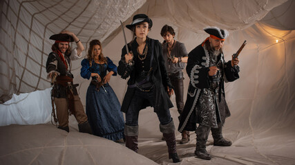 Pirate crew, pirate sailors, a group of different characters, pirate carnival costumes