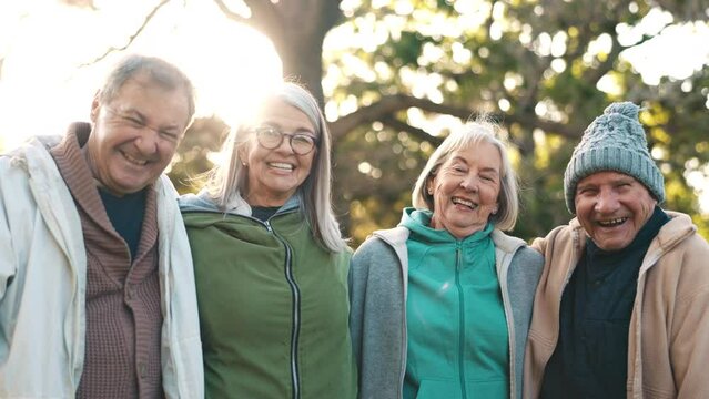Happy people, senior and friends with embrace in park for love, care or trust in bond. Man, woman and together with smile, excitement or laugh for funny joke in nature on retirement for relaxing