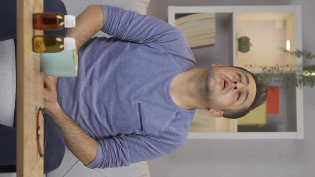 Vertical video of Sick man with rapid breathing. The man cannot control his breathing.