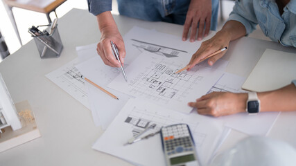Two engineer architect discussion to inspecting sketching about interior architectural building and...