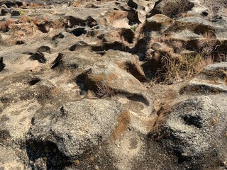 The view of the water in the dam during the dry season with its rocks is very beautiful
