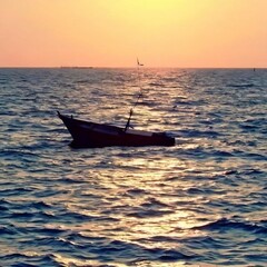 fishing boat on the beach. beautiful sunset on the beach