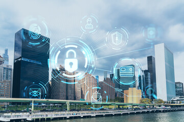 Fototapeta na wymiar New York City skyline, United Nation headquarters over the East River, Manhattan, Midtown at day time, NYC, USA. The concept of cyber security to protect confidential information, padlock hologram