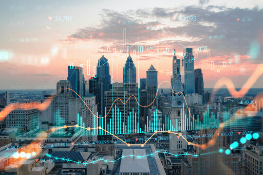 Aerial panoramic skyline of Philadelphia financial downtown, Pennsylvania, USA. City Hall Clock Tower at sunset. Forex candlesticks and bar graph hologram. The concept of internet trading, brokerage