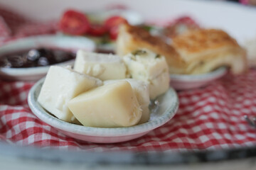 cheese cube in a small bowl on a breakfast table x