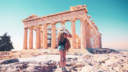 Young female tourist admiring the Parthenon, Acropolis in Athens- travel, tour tourism in Greece