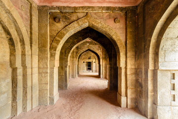 Open air hall room with vaulted roof and arched doors in Mughal style, around the tomb of Sikandar...