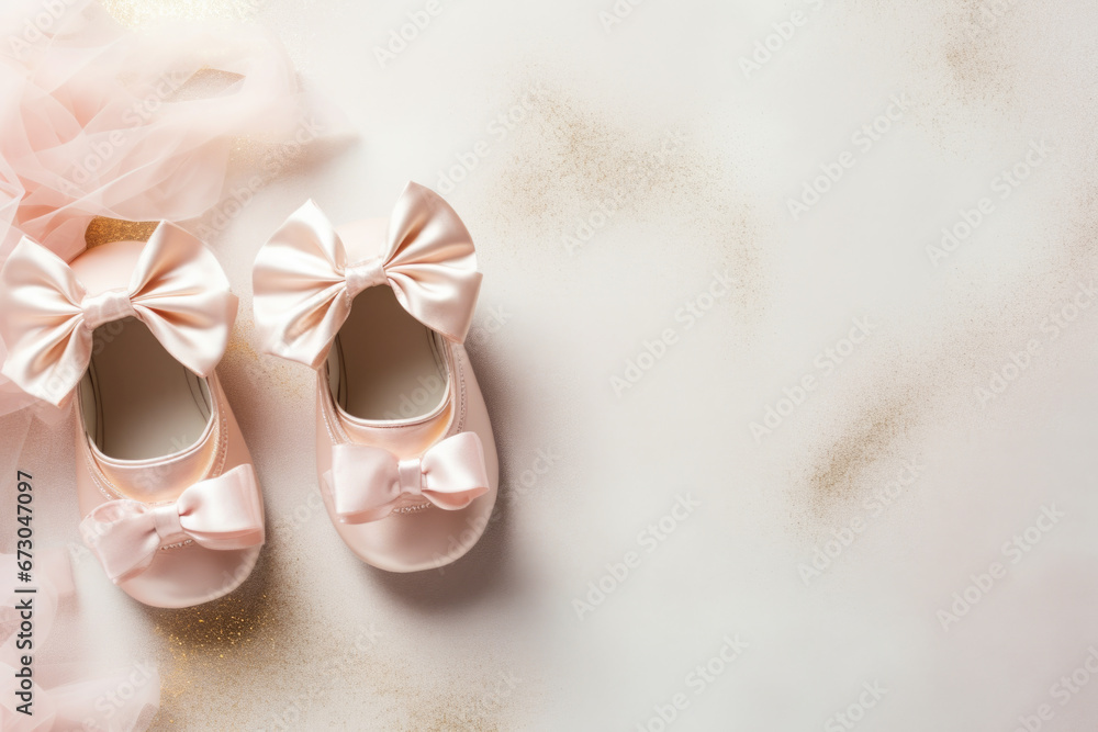 Wall mural cute baby shoes for new born girl on light background with space for text