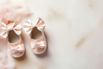 Cute baby shoes for new born girl on light background with space for text