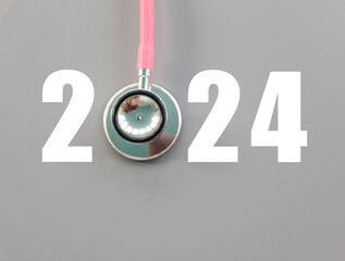 Stethoscope with number 2024 on gray background