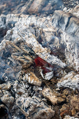 A piece of broken glass with smoke coming out of it.