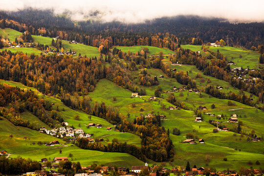 Swizerland Autumn Aerial landscape photography. View of Switzerland village valley from hight.