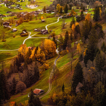 Autumn Aerial landscape photography. View of Grindelwald village valley from cableway. Wetterhorn and Wellhorn mountains, Switzerland, Europe. Traveling concept .