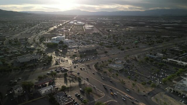 High wide aerial over Henderson Nevada busy suburbs at sunset