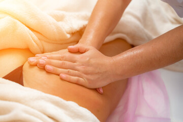 Facial massage. A woman is given a massage in a beauty salon. Close-up.