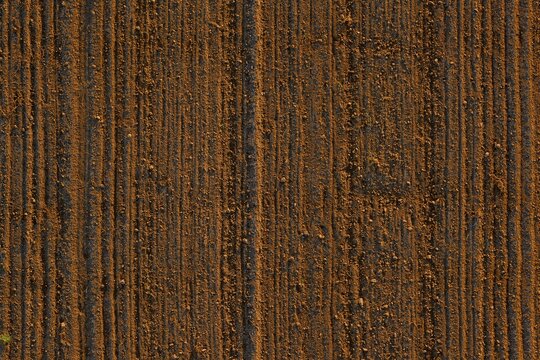 Picture of an aerial view of a field with tractor tracks