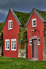 Icelandic folk buildings. A traditional colorful building with a grass roof