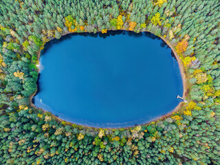 Aerial view of a lake in the forests of Lithuania, wild nature. The name of the lake is "Kuleinis", Varėna district, Europe.