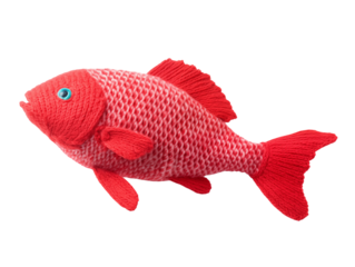 Knitted toy red fish with a white border on the scales. Isolated on a transparent background.