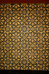 Fototapeta premium Texture or background of Thai art is a leaf pattern on the temple Buddhist Church window at Wat Sra Long Ruae.