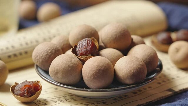 Dried longan on wooden table