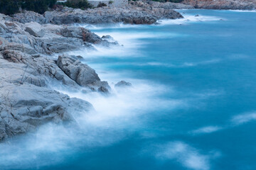 the sea crashing against the rocks