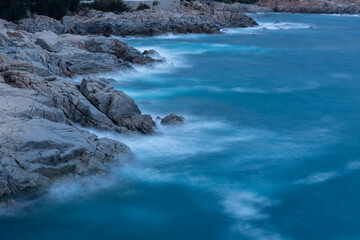 the sea crashing against the rocks