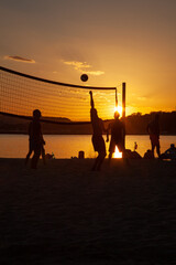 people play volleyball on the beach 