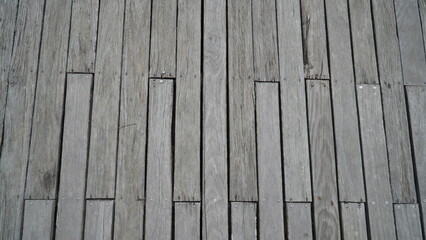 Wall made of boards, wooden background, gray boards. Old wood