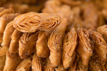 Khaja snacks layered fritters dunked In sugar syrup, for sale in puri odisha india.