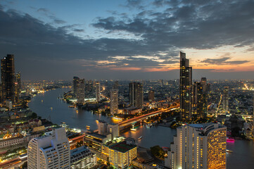 Scenic view curved of the Chao Phraya River in Bangkok city downtown during twilight, capital of Thailand