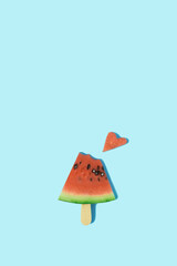 Watermelon on an ice cream popsicle and watermelon heart. Creativ love food summer concept.