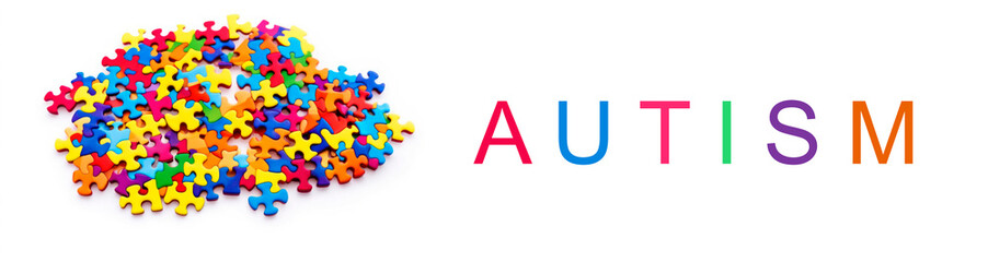 World autism awareness day banner.A a bunch of colorful puzzle pieces on a white background