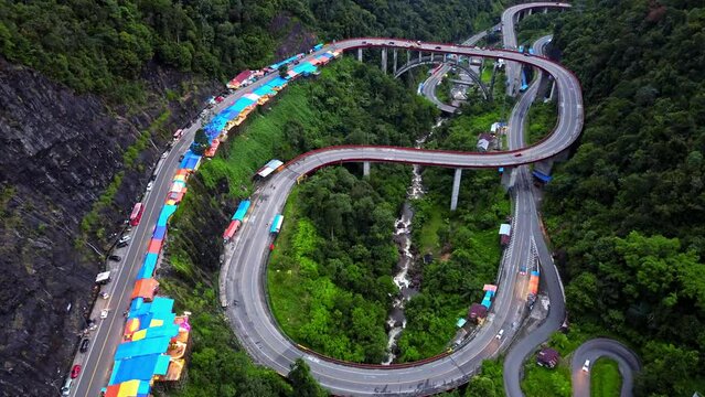Aerial 4k video of Kelok 9 bridge at dusk. A popular bridge in Sumatra to commute between cities.