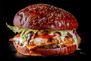 very big burger with meat, vegetables and cheese