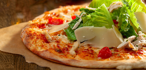 Tasty fresh baked pizza with cheddar and fresh greens.