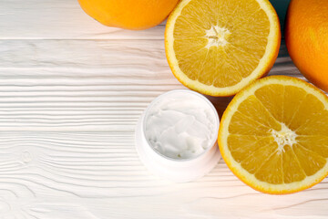 Cream with citrus extracts. Selective focus. Spa day, concept of freshness cream can with lemon lime and orange extract