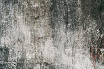 Grunge style urban weathered shabby  peeled painted concrete unique moody surface of the wall with holes, dirty scratches and cracks macro