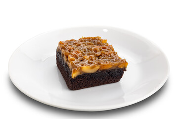 Toffee cake topping with cashew nut and caramel in white ceramic dish isolated on white background with clipping path.