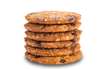 Side view stack of delicious homemade crunchy oatmeal biscuits with chocolate chips isolated on white background with clipping path.
