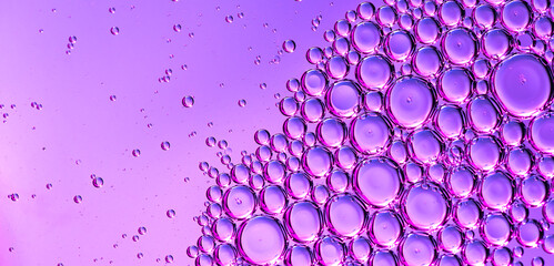 Abstract cosmetics bubbles floating background. Liquid purple abstract backdrop. Flowing colorful abstract rounds. Beautiful violet floating texture. Liquid Art Wallpaper. Flowing Surface