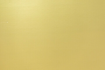 The texture of corrugated cardboard craft paper - gold. Gold corrugated cardboard useful as a background and texture.