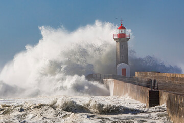 Fototapeta na wymiar Storm waves over the Lighthouse