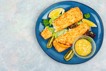 Fried pollock fillets with breadcrumbs